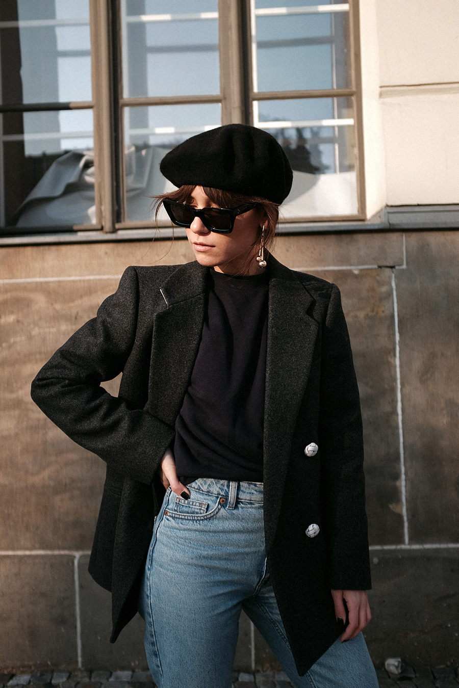 Nisi is wearing: Balenciaga Giant 12 City Bag, Céline Kate Sunglasses, Wool beret, Wrap coat, Mom jeans, Wool blazer, Sweater, Acne Studios Jensen Boots