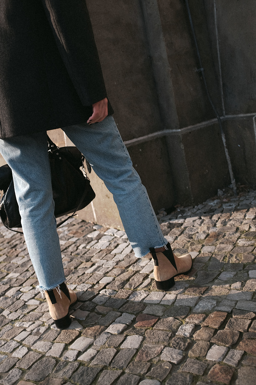 Nisi is wearing: Balenciaga Giant 12 City Bag, Céline Kate Sunglasses, Wool beret, Wrap coat, Mom jeans, Wool blazer, Sweater, Acne Studios Jensen Boots