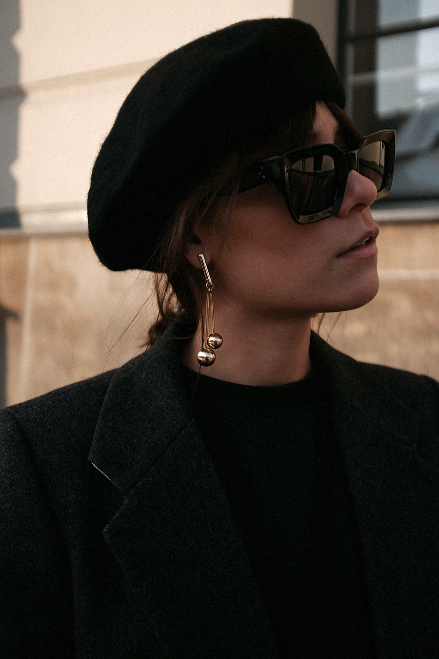 Nisi is wearing: Balenciaga Giant 12 City Bag, Céline Kate Sunglasses, Wool beret, Wrap coat, Mom jeans, Wool blazer, Sweater, Acne Studios Jensen Boots