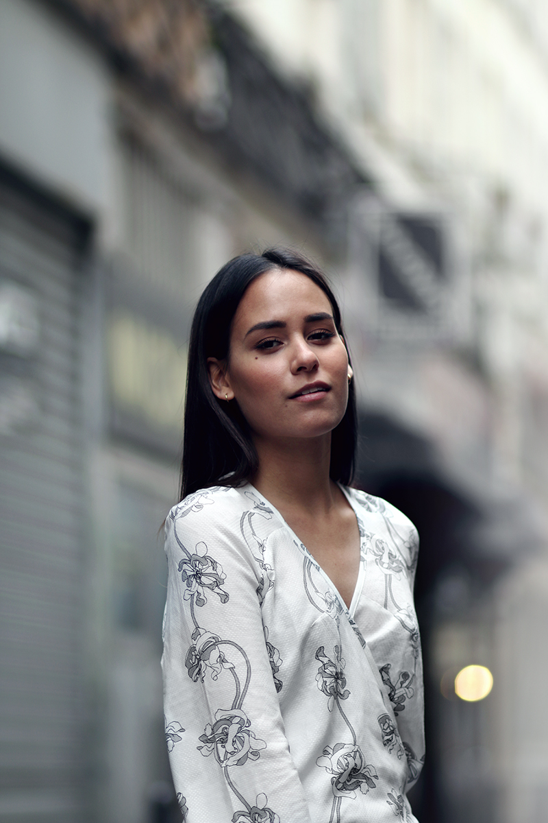 Nisi is wearing: Rodebjer floral wrap top, Chloé Gabrielle Clutch, Warehouse wide leg trousers