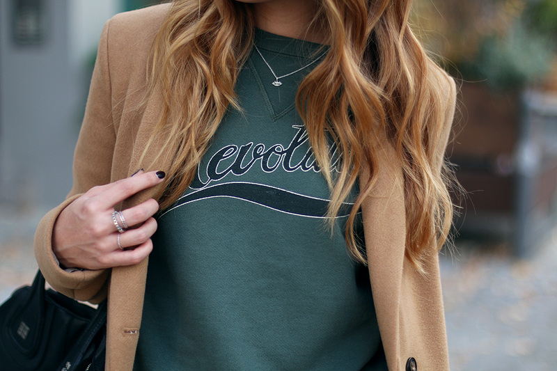camel coat in a sporty ensemble
