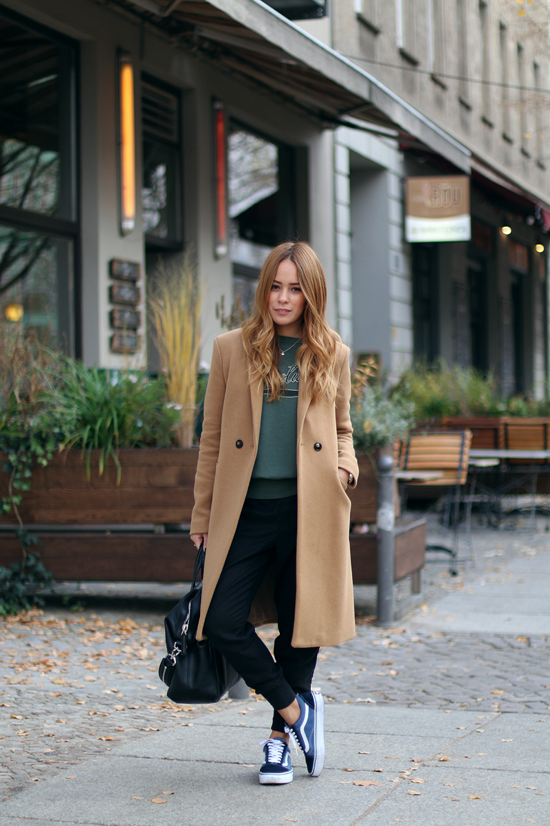 camel coat in a sporty ensemble