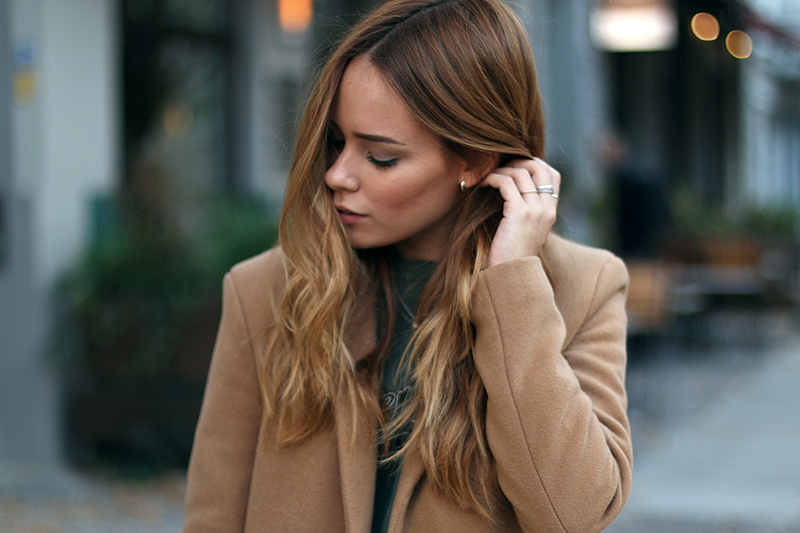 camel coat in a sporty ensemble