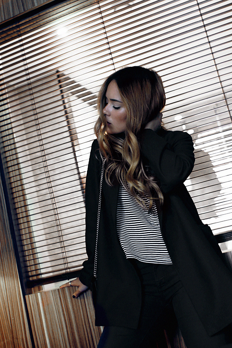 Desi is wearing a striped top. Having a look at the new Rouge Dior lipsticks in Düsseldorf