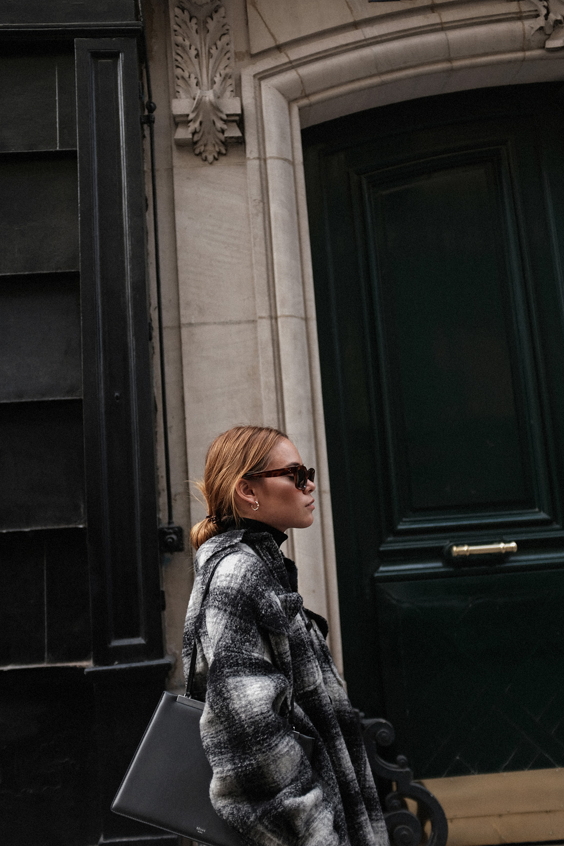 Desi is wearing: Isabel Marant Gario Oversized wool jacket, Manolo Blahnik Slippers, Céline Sunglasses Arket Leggings, Filippa K Turtleneck top, Earrings by teetharejade