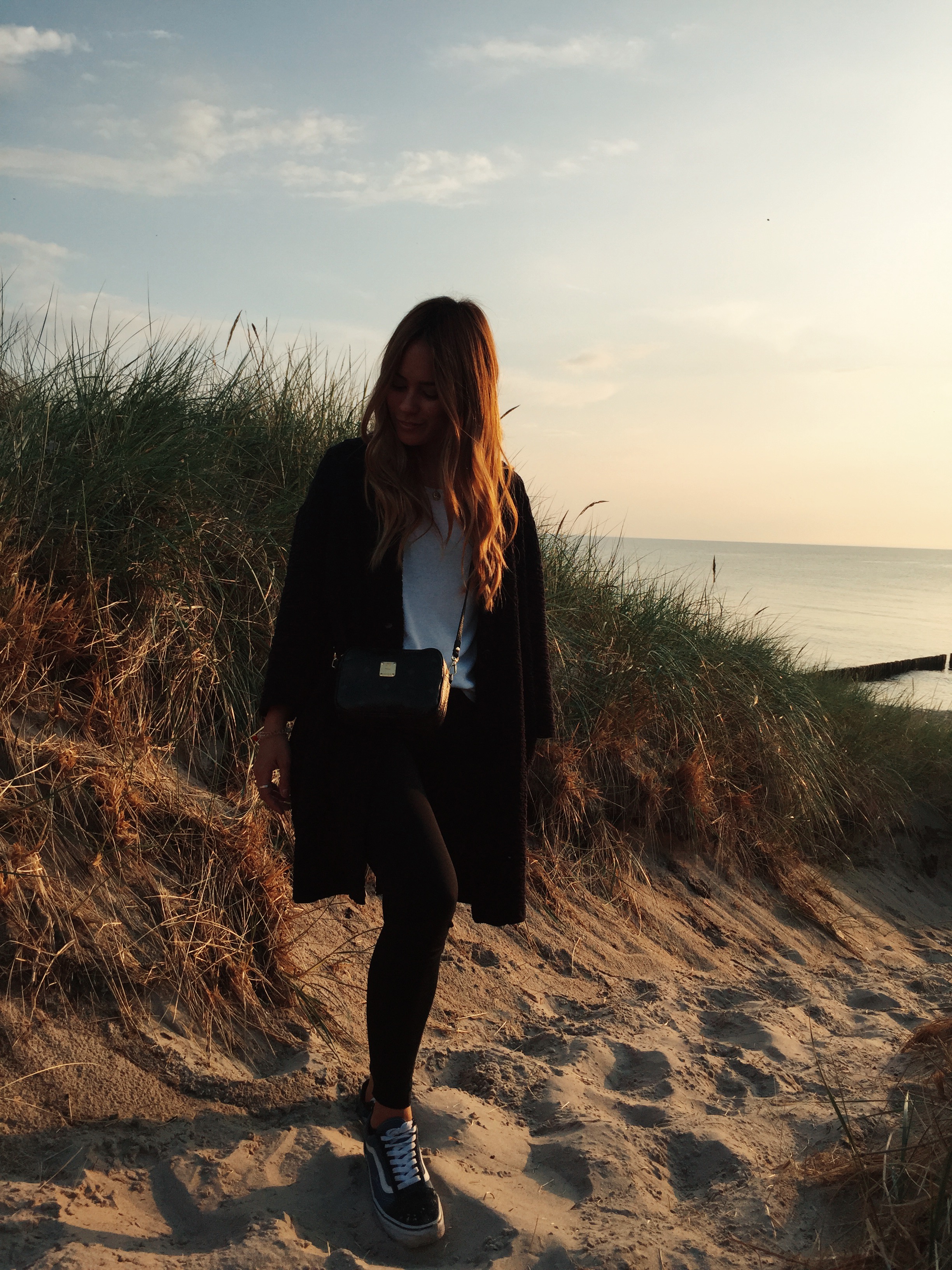 Desi is wearing COS jacketm Minki shirt, Nike leggings, Vans old skool sneaker, MCM bag