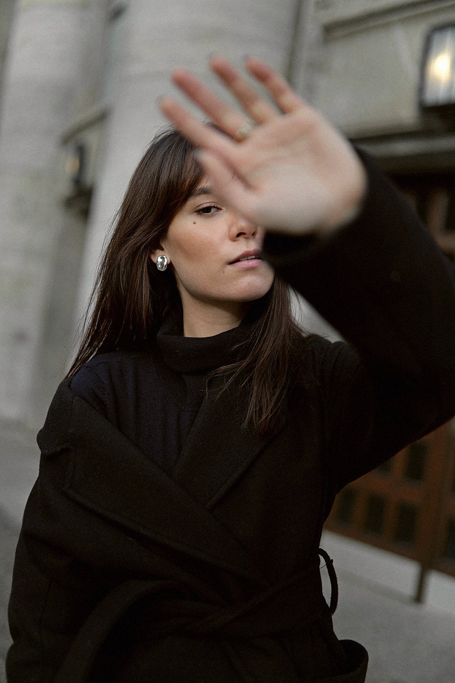 Outfit: Wrap coat and long straight denim. Nisi is wearing: Belted wrap coat, Navy Turtleneck, straight denim jeans, Sock boots, Loewe Puzzle bag