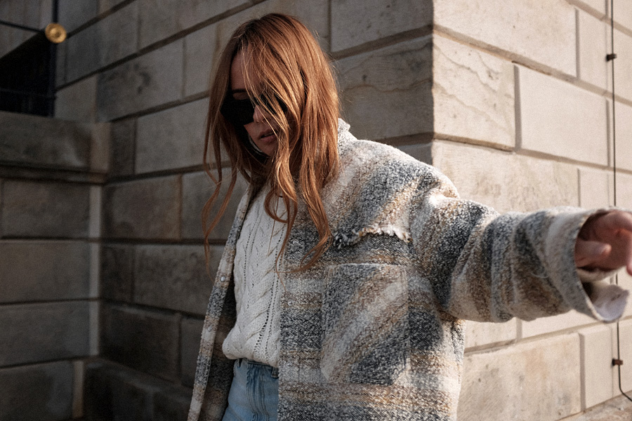 Outfit: Cable Knit and Cropped Flared Denim. Desi is wearing: Céline Madame Boots, Céline Eva sunglasses, Mansur Gavriel Elegant bag, Cropped flared denim jeans, checked wool-blend bouclé shirt, cable knit jumper