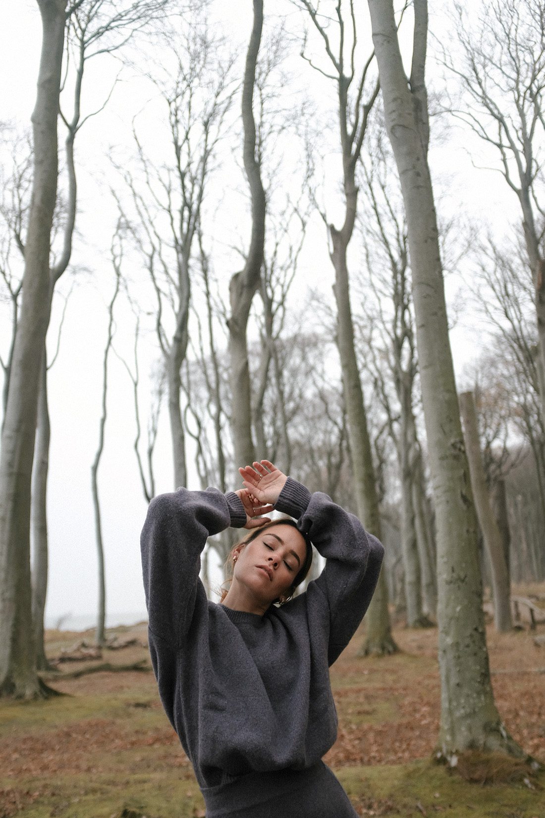 Desi is wearing a knitted two piece from Mango with Céline Santiag boots and Céline big bag in rain coat fabric