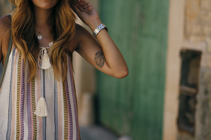 Moon & clouds tattoo, striped shirt with tassels