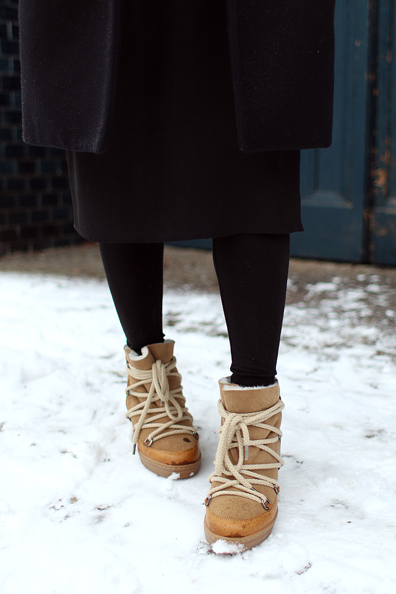 Nisi is wearing: Gucci Dionysus Bag, Isabel Marant Nowles Boots, Midi silk dress, wool coat and cropped turtleneck sweater