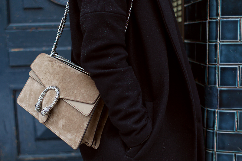 Nisi is wearing: Gucci Dionysus Bag, Isabel Marant Nowles Boots, Midi silk dress, wool coat and cropped turtleneck sweater