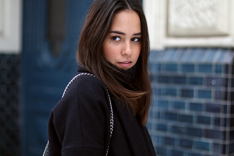 Nisi is wearing: Gucci Dionysus Bag, Isabel Marant Nowles Boots, Midi silk dress, wool coat and cropped turtleneck sweater