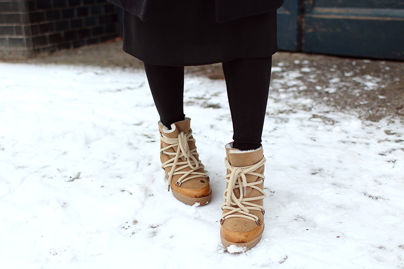 Nisi is wearing: Gucci Dionysus Bag, Isabel Marant Nowles Boots, Midi silk dress, wool coat and cropped turtleneck sweater