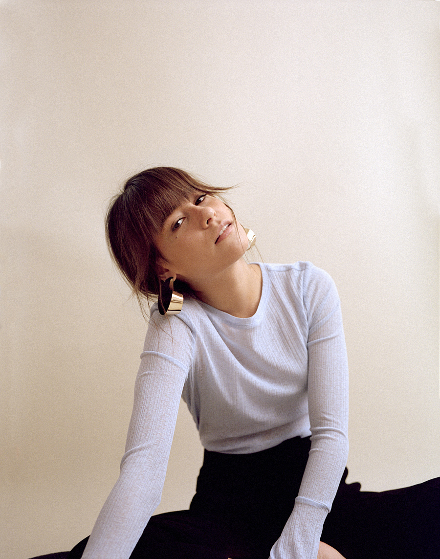 Outfit: Blue shirt and white sweater vest. Nisi is wearing: Blue longsleeve, White sweater vest, Culottes, Earrings