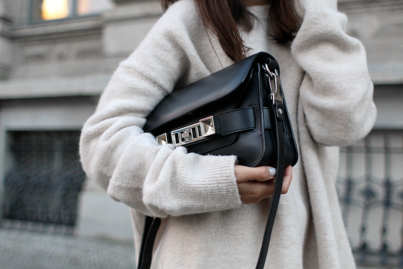 Outfit - Wide and comfy. Nisi is wearing: White wide-leg pants, oversized knit sweater, Proenza Schouler PS11 Mini Classic Bag, Hermès Oran sandals