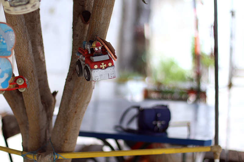 Nisi is wearing a knitted two piece from American Apparel, blue Givenchy Obsedia bag and yellow sunglasses from Komono