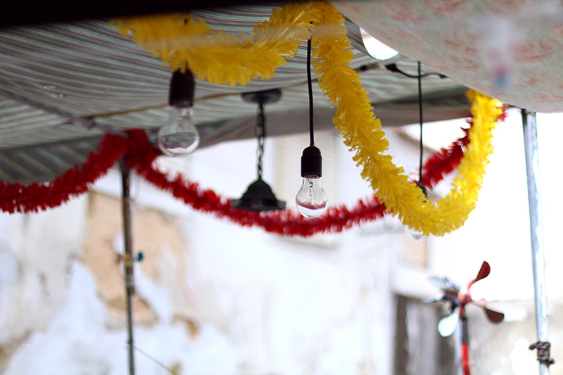 Nisi is wearing a knitted two piece from American Apparel, blue Givenchy Obsedia bag and yellow sunglasses from Komono